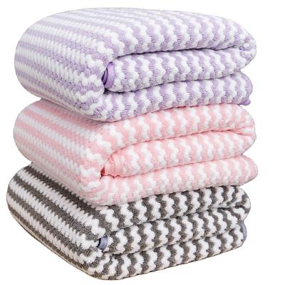 China Coral Velvet Striped Bath Towel Disposable High Density Absorbent And Quick-Drying Couples Bath Towel For Bathroom for sale