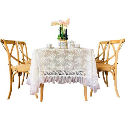 China Non-slip dustproof home solid floral lace ruffle rectangular dining table cover patterned hollow white tablecloth for sale