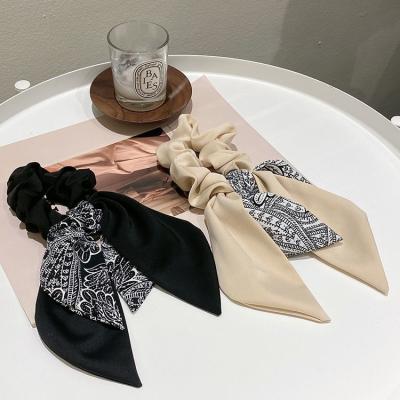 China New high quality fashion style fabric broken flower bow ribbon hair tie hair rope women bow simple fashion hair scrunchies for sale