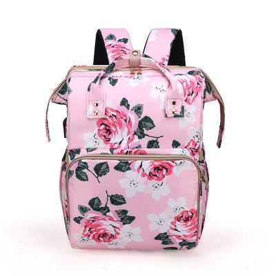 China With USB Hot Sale Flower Pattern Custom Waterproof Mommy Baby Diaper Bags Backpack With Baby Bed for sale