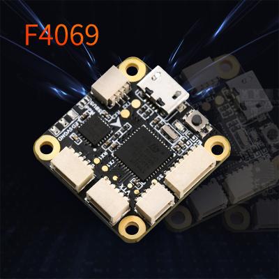 China TCMMRC F469 20mmx20mm F4 Flight Controller Fpv Racing Drone Integrated OSD Controller 2.5/3 Inch F4069 Frame Flight Controller for sale