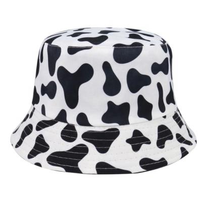 China New Image Fashion Cow Pattern Bucket Hats Fisherman Hats Black Caps For Women Summer White Reversible for sale