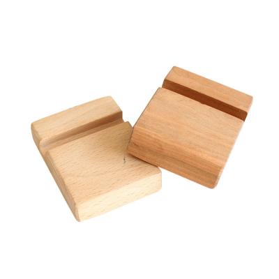 China Custom Universal Bamboo Mobile Phone Stand Europe Wooden Mobile Phone Stand for sale