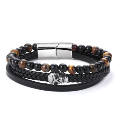 China Nickel free; 2021 Hot Handmade Woven Leather Bracelet Lead Free Amazon Skull Lava Rock Volcanic Stone Multilayer Bracelet For Men's Gift for sale