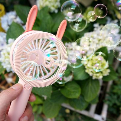 China Hand Fan Electric Portable Mini Bubble Toy Fan Plastic Bubble Toys With Night Light USB Rechargeable Toys For Kid for sale