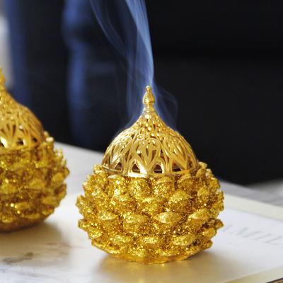 China 2021 New Resin Pine Cones Middle East Arabic Incense Holder Mabkhara Hot Gold Hard Censer for sale