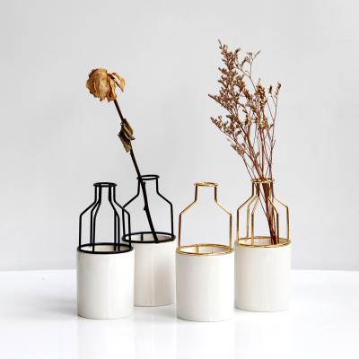 China Hydroponic vases hard to 2021 new modern minimalist ceramic tabletop vase flower vases hot porcelain and metal wrought iron for sale