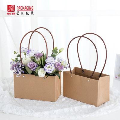 China ANTI-STATIC Waterproof Portable Leather Folding Trapezoid Paper Bag Flower Arrangement Gift Box Kraft Paper Handbag for sale