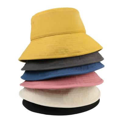 China Character Fisherman Hat Wholesale Men And Women Solid Wide Brim Sunscreen Polyester Bucket Hat for sale