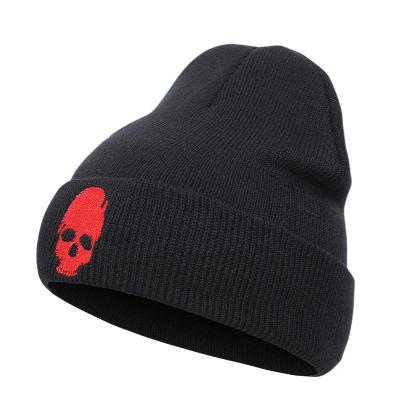 China Custom Black Winter COMMON Hat Skull Embroidery Logo Winter Leisure Warm Acrylic Beanie Hat for sale