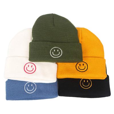 China Outdoor Windproof Warm Women And Men Beanie Face Cap 100% COMMON Acrylic Smiling Winter Beanie Knitted Hat for sale