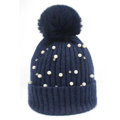 China COMMON pom pom knitted hat women fashion trends Beanie Hat Autumn and winter warm pear Beanie Hats faux fur for sale