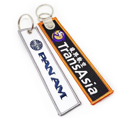 China Creative promotional souvenir woven embroidery logo fabric Key chains for sale