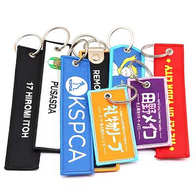 China Wholesale Custom Design Embroidered Cloth Fabric Woven Keychain Special Item for sale