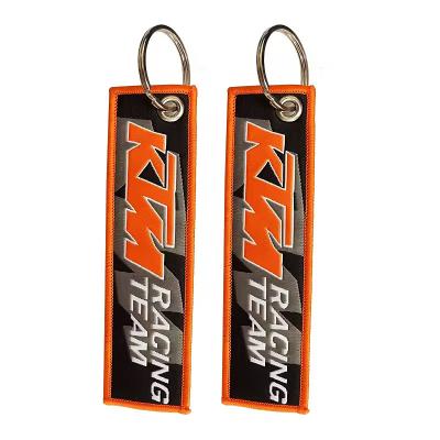 China Customized Logo Design Key Holder Ring Chain Fabric Tag Custom Woven Keychain for sale