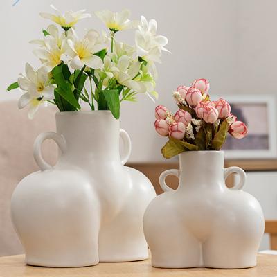 China New Design Minimalist Female Body Art Nordic Black White Ceramic Flower Vase For Dining Room Decoration for sale