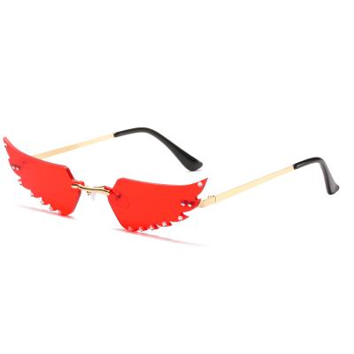 China Diamond Irregular Feather Sunglasses Fashionable Funny Environmental Friendly Party Sunglasses Rimless Women Small for sale