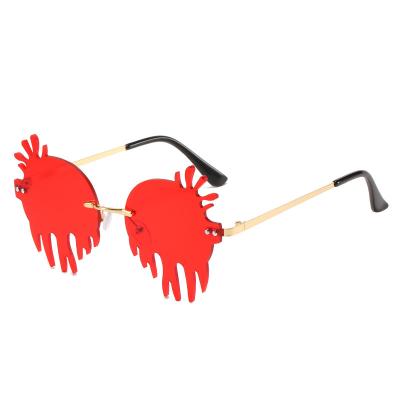 China Newest Fashion Environmental Friendly Unique Rimless Party Funny Drip Sun Glasses Women Candy PC Glasses Party Glasses for sale