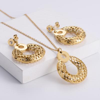 China OL FASHIONABLE Style Hollow Round Shape Pendant Necklace&Earrings For Women Jewelry Set Stainless Steel Gold Color IP Plated for sale