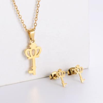 China FASHIONABLE Crown Key 316L Stainless Steel Pendant Necklace Women Stud Earrings Gold Color Jewelry Set SET1008 for sale