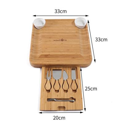 China New Sustainable Bamboo Cheese Board Kitchen Cheese Board With Drawer Knives 4 Fork Set for sale