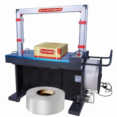 China Automatic PP CLOTHING Tape Packing Bundling Tying Machine for sale