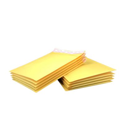 China Delivery Package Wholesale Kraft Paper Bubble Mailer Padded Envelope Yellow Shipping Bag en venta