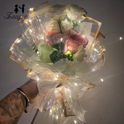 China Zexiang New Style Waterproof Cellophane Led Bouquet Wrapping Paper Lightweight Transparent Korean Paper For Flower Wrapping for sale