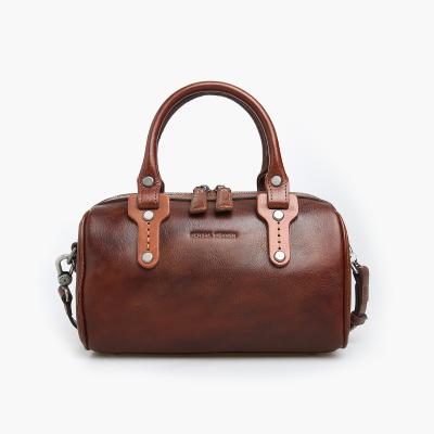 China NATIONAL Style New Online Famous Brands Cow Leather Shopping Unsiys Duffle Handbag Women Bags for sale