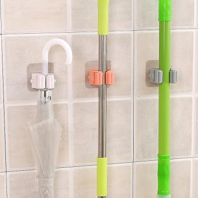 China Traceless Non-Piercing Durable Hanging Broom Brush Mop Hanger Bathroom Storage Holder Broom Clip for sale