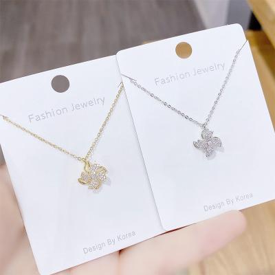 China Vintage Japanese and Korean rotatable childlike girl heart simple rotating windmill clavicle chain pendant female windmill necklace for sale