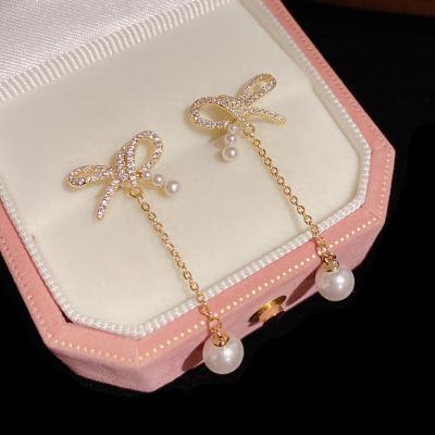 China Vintage Japan and South Korea 2022 new fashion simple pearl cold wind earrings bow tassel earrings Women's for sale