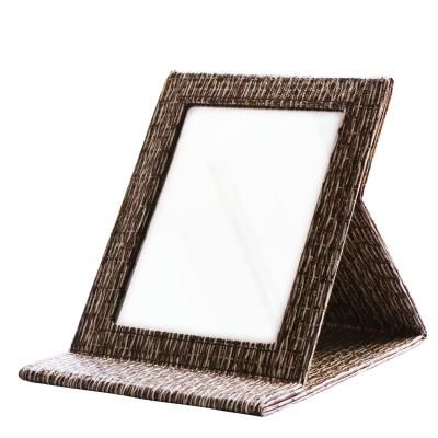 China Hotel Bathroom Dressing Table Mirror Personalized Glass Leather Folding Mirror for sale