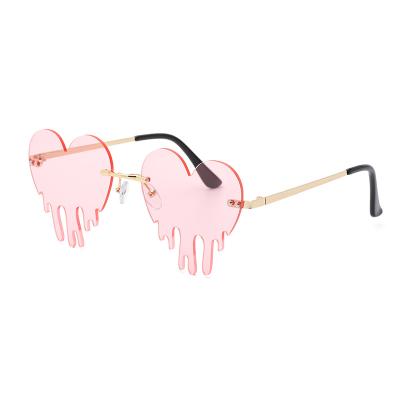 China Hot Selling Fashion Women's Fashion Heart Pink Rimless Drip Frames Shade Sunglasses For Halloween Christmas Party for sale