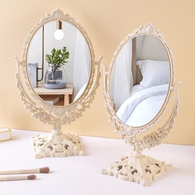 China 360 Degree Rotation European Style Table Top Makeup Double Sided Cute Desktop Mirror for Product Photography Props for sale