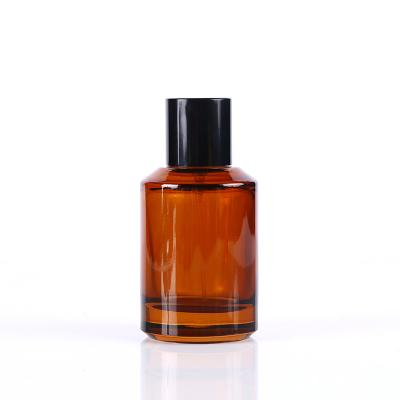 China Personal Care Customzed Empty Glass Round 50ml Amber Perfume Bottle for sale