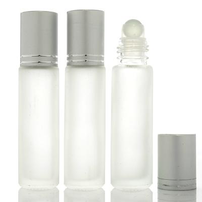 China Personal Care STOCK Glass Roll On 10ml Bottle With Silver And Gold Cap for sale