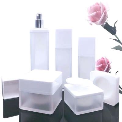 China Eco-friendly Custom Empty 30ml 50ml 100ml Recycled Square Cosmetic White Frosted Plastic Bottle With Pump Dispenser Set for sale