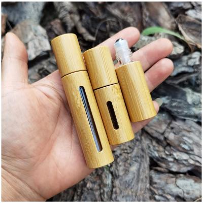 China New Design 5ml 10ml Bamboo Personal Care Serum Bottles For Cosmetics Stainless Steel Roller Bottle for sale