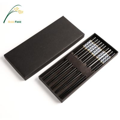 China Sustainable Japanese black wooden chopsticks with wave pattern for sale