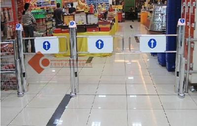 China Supermarket Swing Gate Grocery Store Electric Security Gate for sale