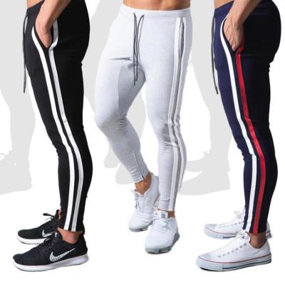 China Anti-Wrinkle Mens Gym Pants Tracksuit Bottoms Joggers Bodybuilding Clothing Striped Skinny Navy Sports Tracksuit With Custom Designs for sale