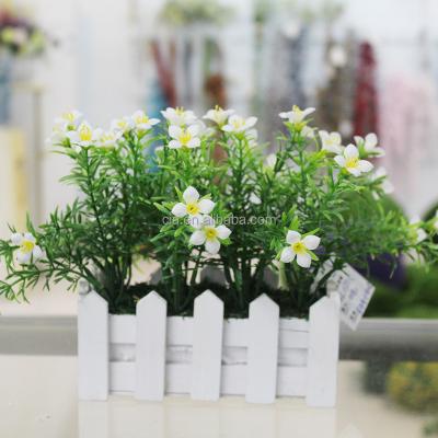 China Cheap Artificial Flower Potted Flower Plant Small Potted Daffodil In White Wood Planter For Sale for sale