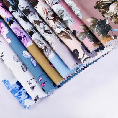 China Stretch Custom Design Stretch Soft Comfortable Polyester Woven Digital Printed Fabrics For Women Garment for sale