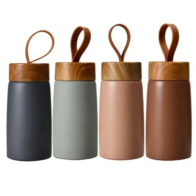 China Sustainable Hot Sale Double Wall Insulated Water Bottle With Lid And String Custom Travel Mini Thermal Coffee Cup for sale