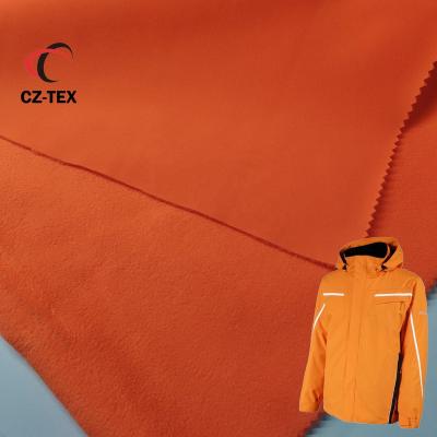 China Waterproof 3 Layer Polyester Spandex Softshell Fleece Fabric Waterproof softshell stretch booded fleece fabric for jacket for sale