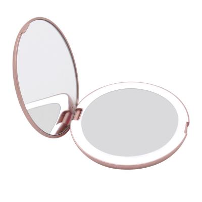 China Modern Warm Portable Makeup Mirror LED Handheld Mirror With LED Lights Makeup Folding Mirror Movable Switch Easy To Carry for sale