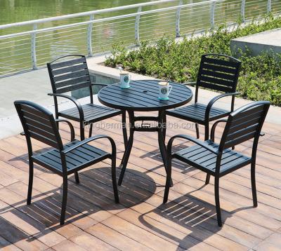 China Modern Use Patio Furniture Plastic Wood Dining Table And Chairs 4 Pcs Chairs Plastic Wood Furniture Table Set for sale