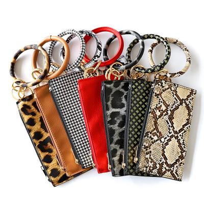 China Gift/Souvenir/Promotion PU Tassel Key Chain Bracelet Leather Ladies Grab Bracelet Phone Bag Sandwich Wallet for sale