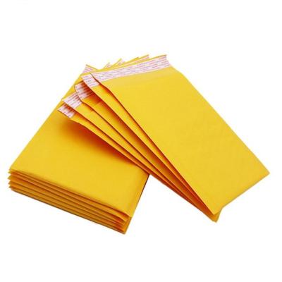 China Custom Size Shock Resistance Yellow Waterproof Kraft Paper Bubble Envelope Mailing Packaging Bag for sale